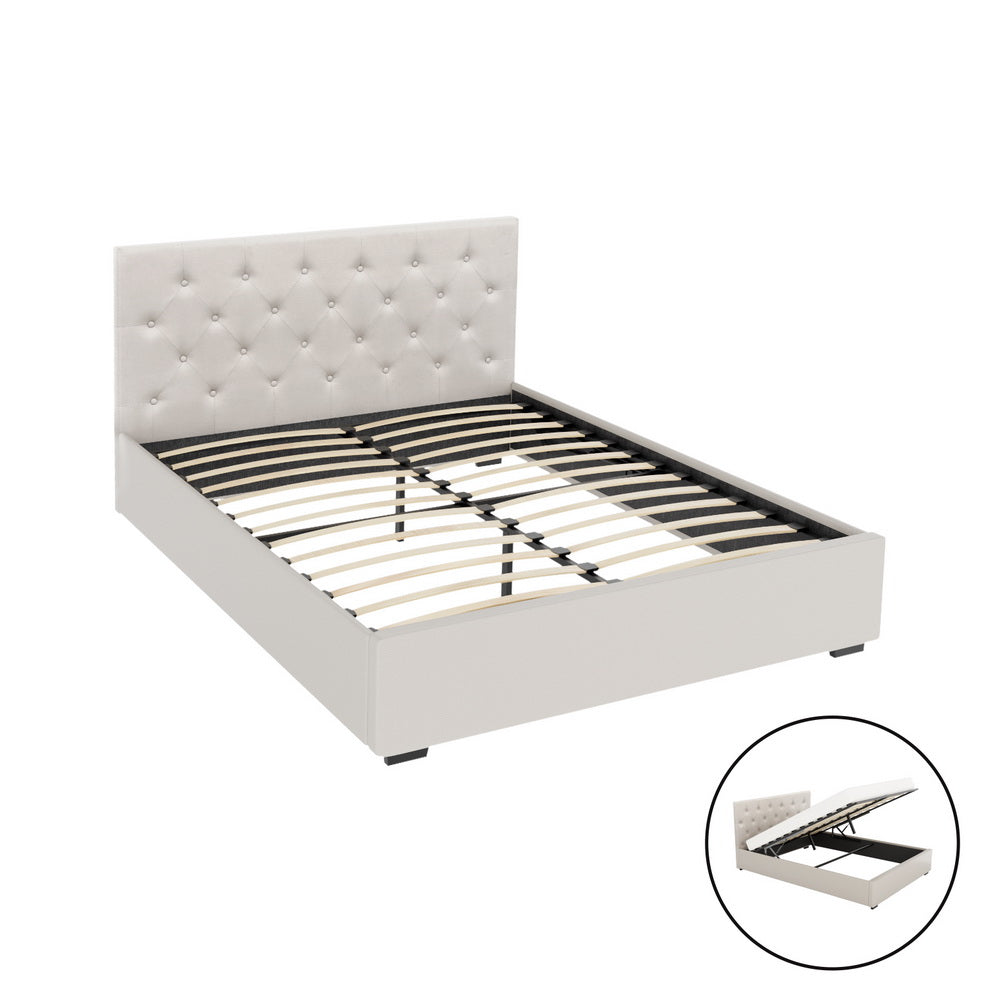 White upholstered bed frame with tufted headboard on a white background